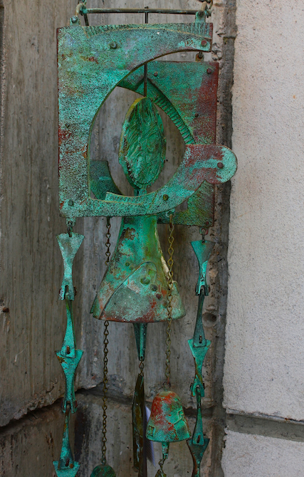 Patina green bronze bell at Arcosanti