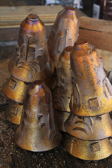 Close-up of bronze hand made bells at Arcosanti